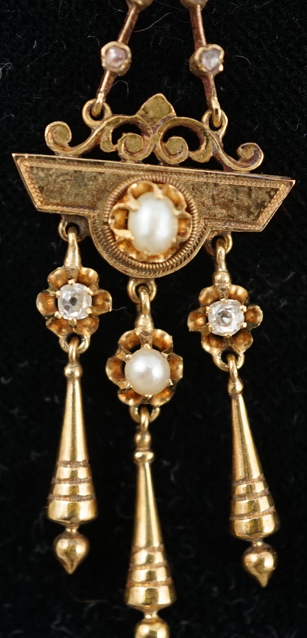 A pair of Victorian gold, seven stone diamond and two stone pearl set triple drop earrings, of aesthetic design